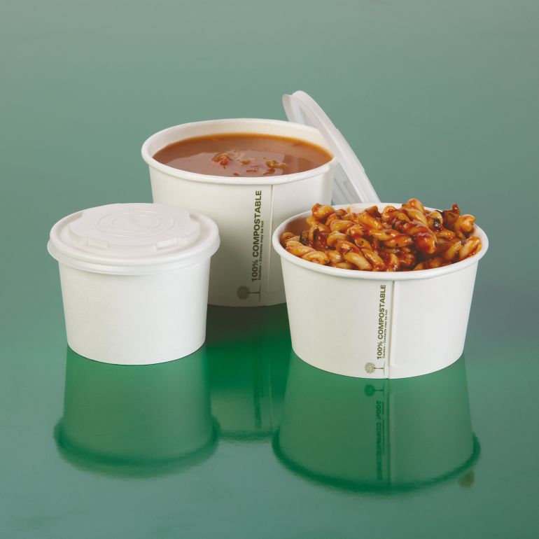 Three white biodegradable soup containers with soup and pasta on a reflective surface
