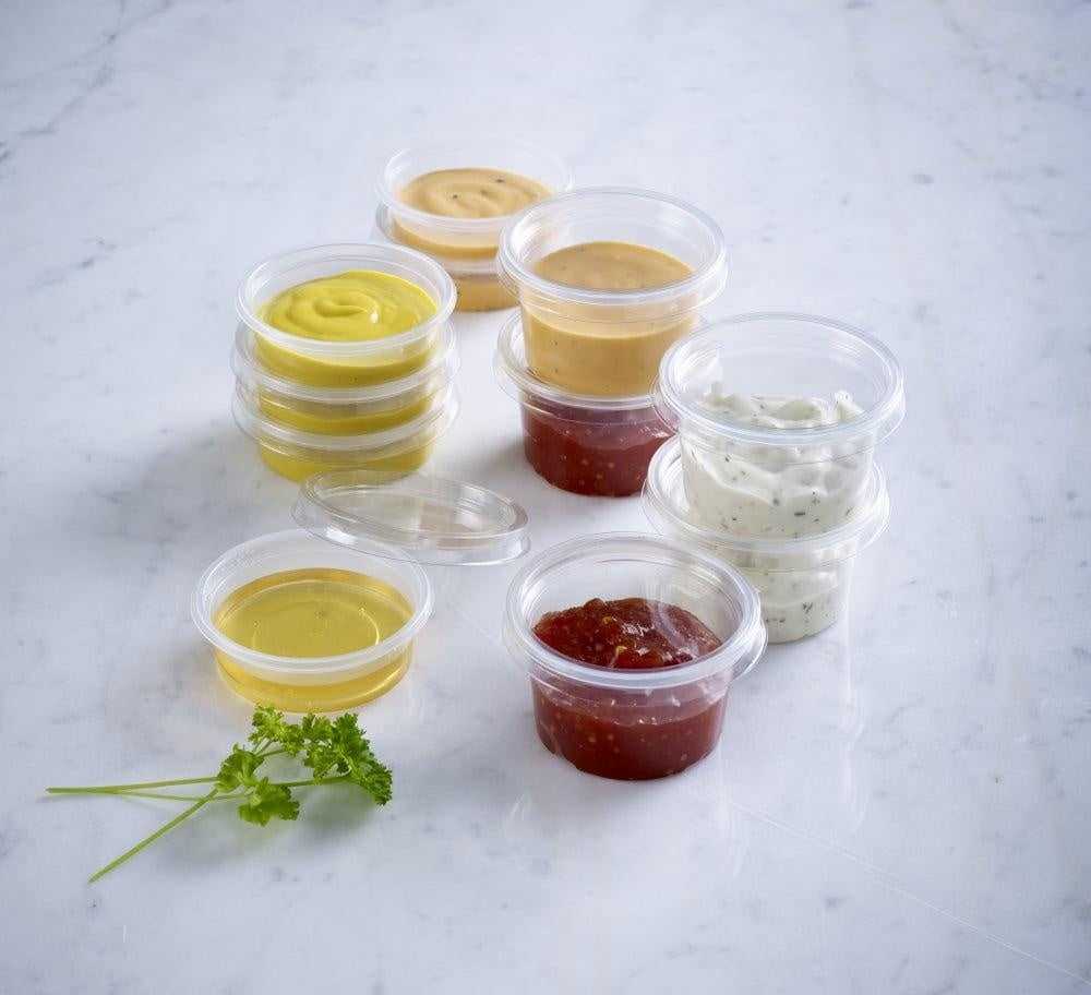 Assortment of dip containers with sauces for taste testers in Sauce & Dip Containers collection