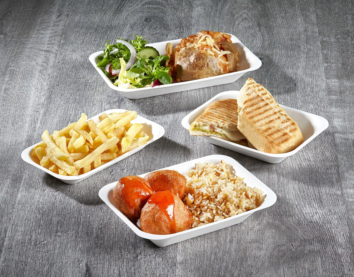 Assortment of takeout food in biodegradable sugar cane bagasse trays
