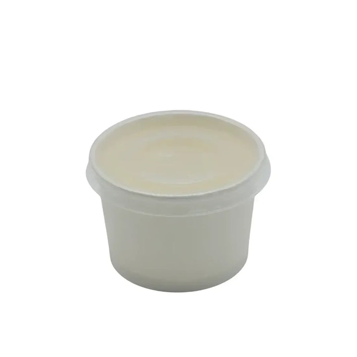 A translucent white plastic 4oz portion pot with a matching pp vented lid for food or cosmetics storage