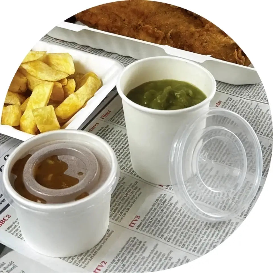 White disposable 7oz white paper cup with pp vented lid containing green mushy peas for portion pots and kraft portion use
