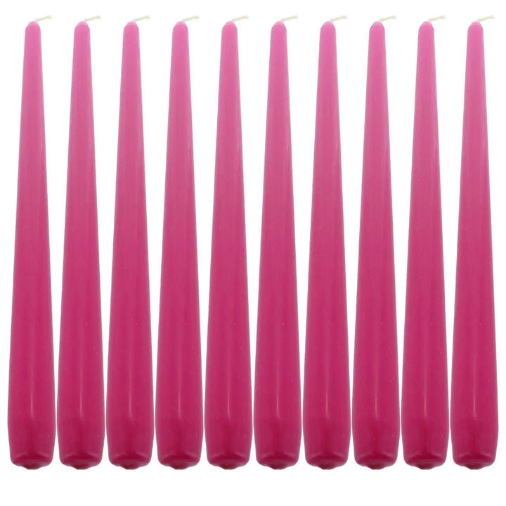 Row of tall pink taper dinner candles for elegant table settings and ambiance