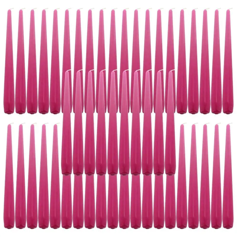 Pink taper dinner candles arranged in rows, perfect for elegant table settings