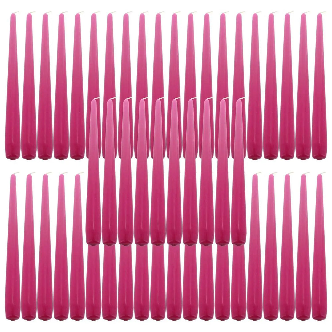 Pink taper dinner candles arranged in rows, perfect for elegant table settings