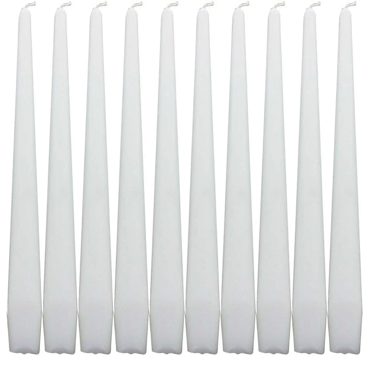 Set of white taper dinner candles arranged in a row for elegant dining decor