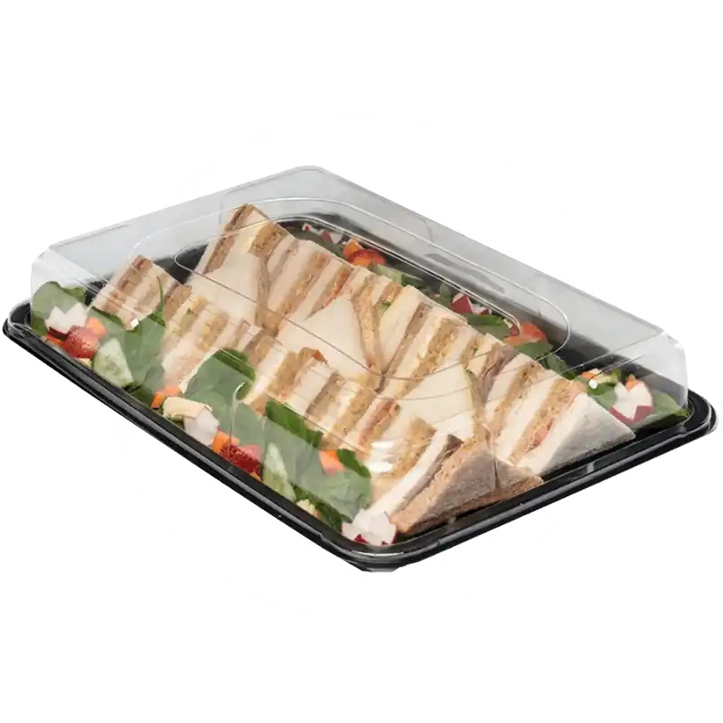 Platter of triangle-cut sandwiches with salad garnish in a plastic container with lid.
