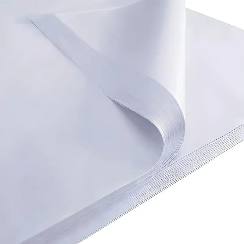 Stack of White Acid Free Tissue sheets with a curled corner for preservation needs