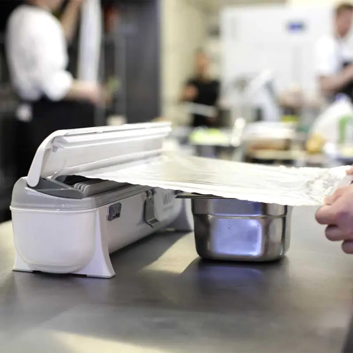 Food packaging machine on stainless steel countertop for Wrapmaster 4500 dispenser - 63M97